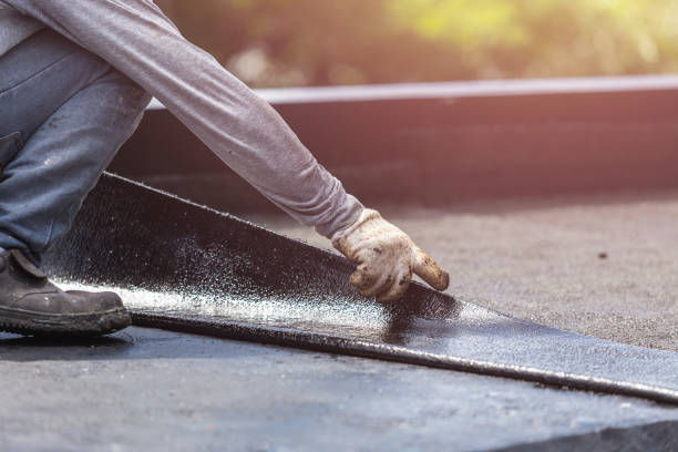 Professional Waterproofing technician working in Ashley, MI